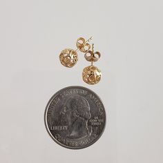 Introducing our Round Gold Filigree Bead Stud Earrings with Diamond Cut, a perfect blend of vintage charm and modern elegance. These earrings feature intricate Italian filigree work and a stunning diamond cut finish. Measuring 15 mm (9/16 in.) in length and 5 mm (3/16 in.) in width, with a total weight of 6 grams, they offer a sophisticated look suitable for any occasion. Ideal as a thoughtful gift or a chic addition to your jewelry collection." ✓ Dimensions: 15 mm (9/16 in.) length, 5 mm (3/16 Ornate Round Earrings For Anniversary, Round Gold Earrings With Diamond Cut, Traditional Round Diamond Cut Earrings, Nickel-free Yellow Gold Round Bead Earrings, Vintage Gold Cluster Earrings Gift, Gold Diamond Cut Round Bridal Earrings, Vintage Gold Diamond Cut Earrings, Vintage Diamond Cut Earrings As Gift, Gold Earrings With 14k Round Beads