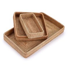 two woven trays sitting on top of each other