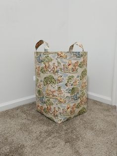 a large storage bag sitting on the floor in front of a white wall and carpet