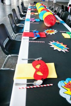 a long table with chairs and decorations on it