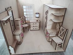 a cut out of a dollhouse with furniture