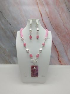 "Handmade and designed by me-one of a kind necklace set-spiral bead crochet necklace with pink seed beads-24\" long-a 2 1/4\"x1 1/4\" rectangle crazy lace agate pendant beads-quartz barrel beads-silver tone metal tear drop beads-metal beads-2 1/2\" long matching dangle earrings with an ear wire-toggle clasp is in the front-silver tone findings. This beautiful summer necklace set would make great addition to your jewelry wardrobe! The necklace is easy on because of the toggle clasp is in the front!" Pink Bohemian Jewelry With Faceted Beads, Bohemian Pink Jewelry With Faceted Beads, Pink Dangle Beaded Necklaces, Pink Beaded Chain Dangle Jewelry, Pink Dangle Jewelry With Beaded Chain, Handmade Pink Dangle Jewelry, Pink Beaded Jewelry For Jewelry Making, Pink Dangle Jewelry With Faceted Beads, Handmade Pink Jewelry With Round Beads