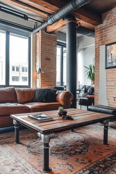 a living room with brick walls and leather couches