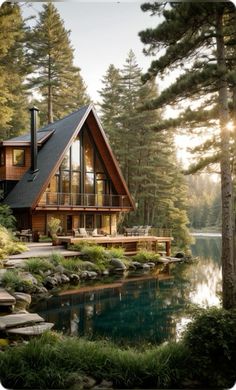 a house in the woods next to a body of water