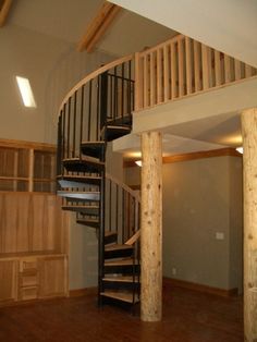 a spiral staircase in the middle of a room