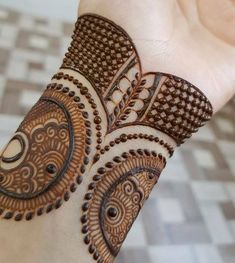 a henna design on someone's hand