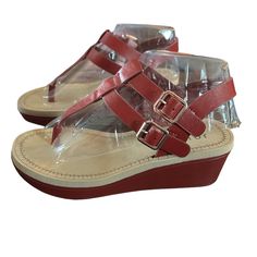 Give Off An Effortless Look For The Sunny Weather With The Bianca Wedge Sandal From Journee Collection. This Silhouette Is Fashioned With T-Strap Styling And Side Buckle Details For Extra Intrigue! Faux Leather Upper Adjustable Buckle Closures Round Open Toe Synthetic Lining Lightly Padded Footbed 1" Platform, 2¼" Covered Wedge Heel Rubber Sole Imported New In Box Size 6 Red Sandals With Buckle Closure For Summer, Red Open Toe T-strap Sandals For Beach, Summer T-strap Wedge Sandals With Heel Loop, Red Buckle Closure Sandals For Summer, Red T-strap Sandals For Summer Beach, Summer T-strap Wedge Sandals, Red Sandals With Buckle Closure For Beach, Red Buckle Closure Sandals For Beach, Red T-strap Sandals For Spring Beach