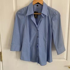 Nwt. Light Blue & White Dress Shirt With Grey Buttons. 77% Cotton, 20% Nylon & 3% Lycra. Machine Washable. Blue Office Shirt For Summer, Blue Shirt For Office Wear In Summer, Blue Office Wear Shirt For Summer, Blue Fitted Blouse For Business Casual, Blue Tops For Office Wear In Spring, Blue White Dress, White Dress Shirt, Blue And White Dress, White Shirt Dress