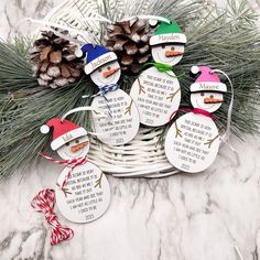 a basket filled with christmas ornaments on top of a marble counter topped with pine cones