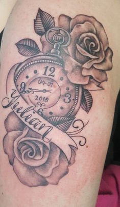 a tattoo with a clock and roses on it