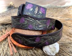 "\"A gift of a thistle\" - this hand tooled leather belt with thistle ornament would definitely attract attention. It reminds me of Scotland, its' hills, lakes, Highlands, Lowlands, cliffs, windy valleys and faeries dancing in the thistle fields... One doesn't have to be Scott to love the atmosphere of Scotland! Thistles symbolise a strong personality and vitality in general and if you're a tough lady (or a gentleman who's married to one) - this belt is waiting for you! ;) Depth of the colours i Adjustable Hand Tooled Belt Perfect For Gifts, Adjustable Hand Tooled Belt As Gift, Artisan Adjustable Belts As Gifts, Adjustable Artisan Belts For Gifts, Handmade Artisan Belt As Gift, Adjustable Artisan Belt As Gift, Handmade Artisan Belts For Gifts, Boho Leather Jewelry, Leather Creations