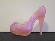 This listing is for one high heel shoe cake topper This listing is for one sugar shoe high heel "glass slipper" cake topper, perfect for the Cinderella in your life (or shoe fanatic!). It is made entirely of sugar, of isomalt to be precise, which is a type of cooked sugar. It would look great either on top of a cake, or order a pair, and put one inside a "shoe box" cake, and one on the top of the "box".(And besides, it's less expensive to order a pair of these than to go to the store and get a r High Heel Shoe Cake, Shoe Box Cake, Shoe Cake, Sugar Shoes, Pink Stilettos, Bubble Gum Pink, Pink Sparkly, Pink Sugar, Glass Slipper