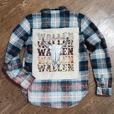 MAKE A CUSTOM ORDER:  Made-to-order, one-of-a-kind, flannel rework.   What would you like to see on your flannel??  I can find the shirts and make a special one-of-a-kind flannel for you! Under PERSONALIZATION, please include the following: 1.  Size (indicate men's or women's, and size up if you'd like an oversized fit) 2.  Theme for the patch on the back (favorite band, team, college or university, movie title, etc) 3.  Color(s) for flannel (I usually match the flannel with the t-shirt I use, but will try to go with a color scheme you prefer) 4.  Bleaching or No bleaching The rest is up to me!  I will create a super cute and unique flannel everyone will love! Pictures are only samples.  Your order will be similar to the pictures. All materials used may be pre-loved, new, gently used, vint Bleach Flannel Shirt Diy, Flannel Rework, Blue Flannel Outfit, Flannel Upcycle, Reworked Flannel, Bleached Flannel Shirt, Bleached Flannel, Flannel Outfits, Clothing Diy