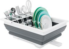 the dish drainer is filled with dishes and utensils in grey and white