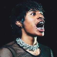 a woman with chains on her neck and mouth