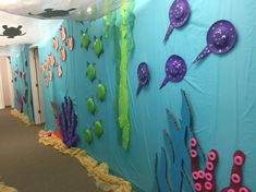 the hallway is decorated with sea animals and other things to decorate on it's walls