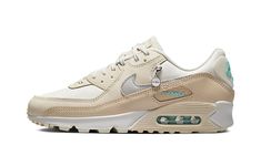 The Women’s Nike Air Max 90 “Mama” is a women’s-exclusive colorway of the vintage running shoe with a premium design.  The always popular, always classic Air Max 90 is treated to an understated yet appealing new look on the “Mama” colorway, a style that features a silver pendant hang tag with “MAMA” and Swoosh hits.  The shoe’s upper is dressed in various white and Sail hues.  Subtle pops of turquoise appear on the “Air Max” branding window on the lateral side, on the “Nike Air” logo on the heel, and on the “Nike” insignia on the fleece tongue.  Release date: October 1, 2022 Womens Air Max 90, Vintage Running, Air Max 90 Women, Shoes Outfit Fashion, Stadium Goods, Nike Womens, Nike Air Max 90, Premium Design, Air Max Sneakers