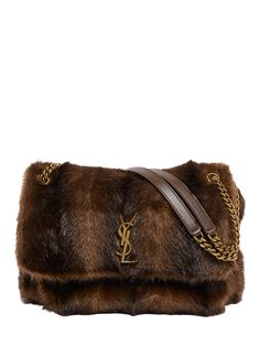 "Find SAINT LAURENT Niki Faux Fur Shoulder Bag on Editorialist. The Saint Laurent Niki shoulder bag is crafted from lamb leather and faux fur. The bag features a signature YSL logo accent, sliding chain/leather shoulder strap, and a flap top with a magnetic closure. The bag also includes an exterior slip pocket under the flap, gold tone hardware, and professional cleaning is recommended. The bag measures 9.1\"H x 12.6\"W x 3.5\"D. This bag is made in Italy." Leather Chain, Faux Fur, Saint Laurent, Shoulder Strap, Gold Tones, Bag Lady, Shoulder Bag, Chain, Leather