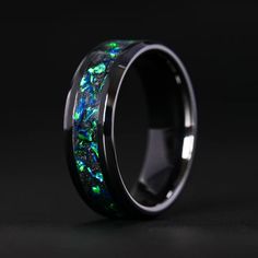 The Black Emerald Opal Glowstone Ring is housed in a durable ceramic band and contains an inlay rich of black emerald opal.Sizing:For orders placed through Facebook or Instagram Shop, please contact us at support@patrickadairdesigns.com to give ... Lavender Opal, Ring Sizer, Shopping App, Instagram Shop, Custom Engraving, Ring Shopping, The Black, Emerald, Opal