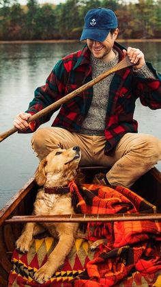 a man in a canoe with his dog