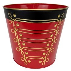 a red and black bucket with gold trimmings