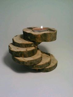 a candle that is sitting on some wood