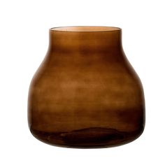 a brown vase sitting on top of a white table