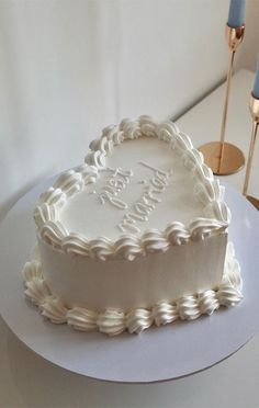 a heart shaped cake sitting on top of a table