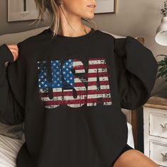 Classic USA Sweatshirt, makes a great gift for the patriotic.  Great for keeping warm on cooler days and evenings. Life just got even cozier with this soft and comfy sweatshirt. This Vintage Style USA Sweatshirt makes the perfect gift; Whether it's Christmas, Mothers Day, Birthdays and or Graduations, It's sure to become a favorite. Perfect for chilly summer evenings and colder days, this sweatshirt will be a staple item all year round. For oversized style/look - please size up. See size chart for reference. Due to monitor settings and lighting, colors may appear slightly different. More about this sweatshirt - 50% cotton, 50% polyester NuBlend® pre-shrunk fleece - Medium-heavy fabric (8.0 oz/yd² (271 g/m - Regular fit - Tear-away label Care Instructions: Machine wash Cold, No Bleach, use Americana Long Sleeve Tops For 4th Of July, Long Sleeve Americana Tops For 4th Of July, Casual Long Sleeve T-shirt With Flag Print, Patriotic Letter Print Sweatshirt For Independence Day, Patriotic American Flag Long Sleeve Tops, Patriotic Long Sleeve Top With American Flag Print, Patriotic Long Sleeve American Flag Top, Long Sleeve Americana Tops With American Flag, Long Sleeve Relaxed Fit T-shirt For 4th Of July