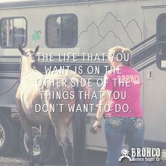 a woman standing in front of a horse next to a trailer with the words, the life that you want is on the other side of the things that you don't want to do