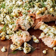 salmon and cauliflower salad on a wooden cutting board