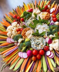 an arrangement of vegetables arranged in the shape of a sunflower