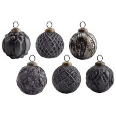 six black and white ornaments are hanging from the top of each ornament,