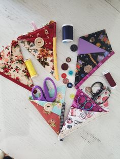 sewing supplies laid out on a white table