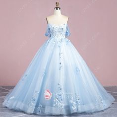 Floral Applique Ball Gown For Debutante Ball, Lace Quinceanera Dress For Sweet 16 During Prom Season, Floral Applique Ball Gown For Quinceanera Or Prom, Quinceanera Ball Gown With Floral Applique For Prom Season, Floral Applique Ball Gown Quinceanera Dress For Prom Season, Floral Applique Quinceanera Dress For Prom, Organza Ball Gown With Floral Applique For Debutante Ball, Blue Lace Quinceanera Dress, Floral Applique Ball Gown For Prom Season