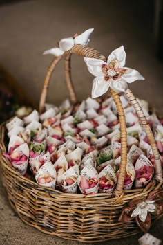 a wicker basket filled with flowers on top of a table next to an instagram page