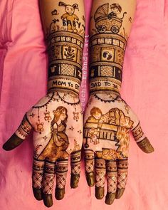 two hands with henna tattoos on top of each other and an image of a woman's hand