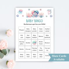 a baby shower game with pink flowers and sea animals on the table next to it