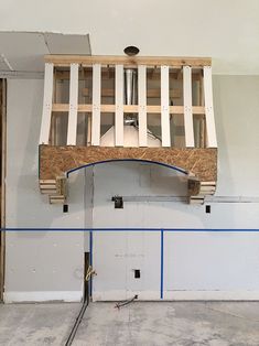 an unfinished fireplace in the corner of a room