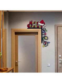 the entrance to an office building with a hello kitty sign on the wall and door