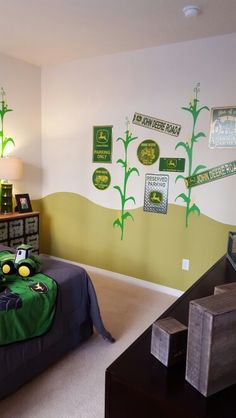 a bedroom decorated in green and yellow with pictures on the wall