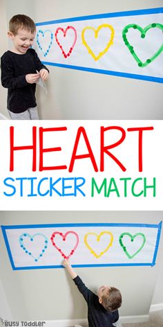 two children playing with heart stickers on the wall