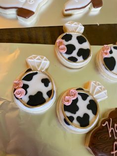 decorated cookies are sitting on top of a table