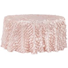 a pink table cloth with ruffles on the edges and a circular design at the top