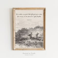 a framed print with an image of two deer in the woods, and a quote written on it