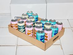 a cardboard box filled with lots of different types of cans