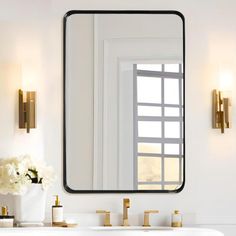 a bathroom sink with a large mirror above it