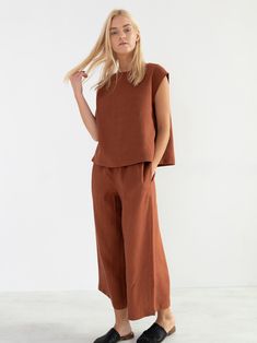 "YARA is a simple linen top. DETAILS - Cap sleeve design - Crew neck - 100% lightweight European linen fabric - Cut and sewn to order just for you in our studio COLOR - Rust, you can also choose other colors above - Fabric samples are available here https://www.etsy.com/listing/586569696/linen-fabric-samples SIZING & FIT - Relaxed, loose fit - Length (shoulder to hem) is approximately 22.5 inches / 57 cm - Bust (pit to pit) is approximately 20.5 inches / 52 cm - Shoulder to shoulder is appro Simple Linen Top, Crochet Long Sleeve Tops, Wide Leg Linen Trousers, Simple Linen, Black Lace Cami, Linen Tunic Tops, Leopard Print Shirt, Handmade Clothing, Linen Tunic