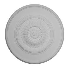 a white ceiling medallion with an intricate design