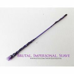 an image of a purple stick that is in the shape of a heart with words brutl impersonial suave